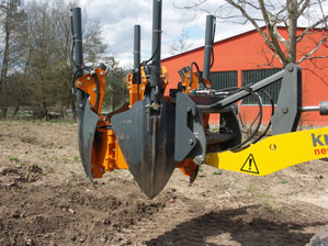 The spades are pushed slowly into the soil.